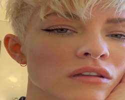 She has piercing in her nose septum and also on her ears.